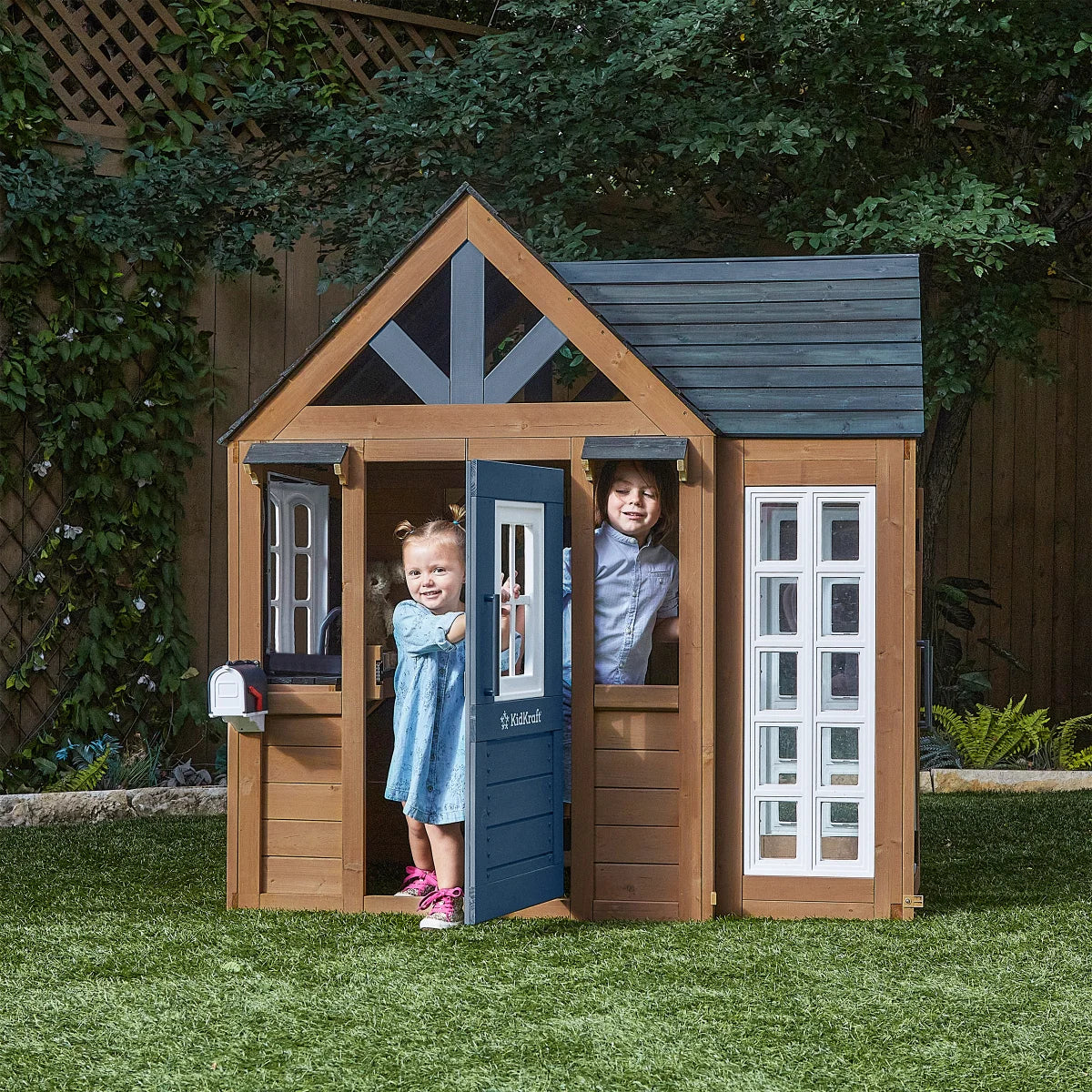 KidKraft Atrium Breeze Wooden Outdoor Playhouse with Sunroom & Play Kitchen